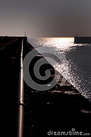 Entrance to Shoreham Harbour at sunset Stock Photo