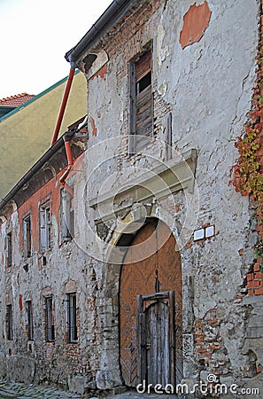 Entrance to the tumbledown building on Kapitulska street in Bratislava Stock Photo