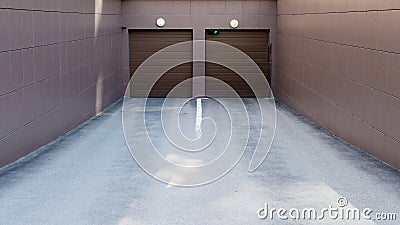 Entrance to the underground parking with closed gates Stock Photo