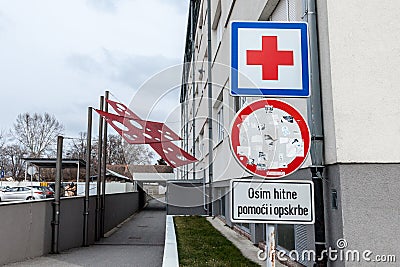 Entrance of the Vukovar Hospital memorial with its iconic red cross, a memorial dedicated to the massacre that occured there Editorial Stock Photo