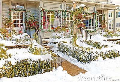 freshly fallen white Winter snow on commercial building entrance walkway at Christmas Stock Photo