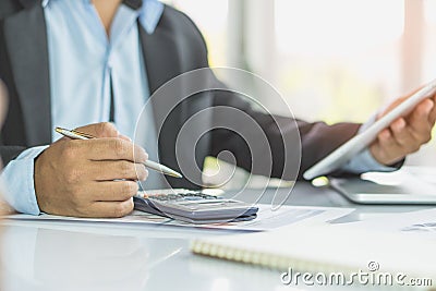 Entrepreneur calculate financial cost. Businessman planning to extend business and calculating budget for develop. Stock Photo