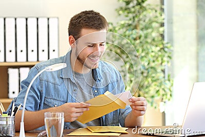 Entrepreneur opening a padded envelope Stock Photo