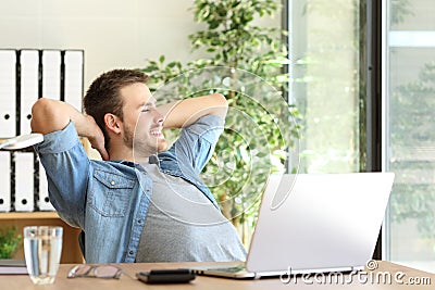 Entrepreneur relaxing and thinking at office Stock Photo