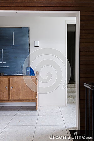 Entry foyer buffet and artwork detail viewed from living area Stock Photo