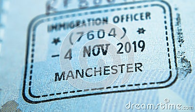 Entry stamp in passport made by immigration officer at border and visa control at Manchester airport in United Kingdom. Selective Stock Photo