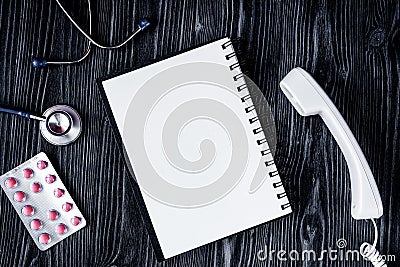 Entry to doctor blank open notebook with stethoscope top view Stock Photo