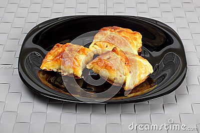 Envelopes of dough stuffed with mushrooms and chicken, baked in Stock Photo