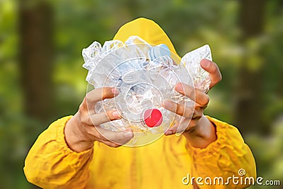 Environment clean up park cleaning trash nature. Volunteer hands holding bottle plastic garbage. Volunteer cleaning Stock Photo