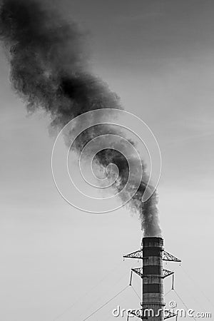 Environmental Damage: Air Pollution. The black smoke of the pipe Stock Photo