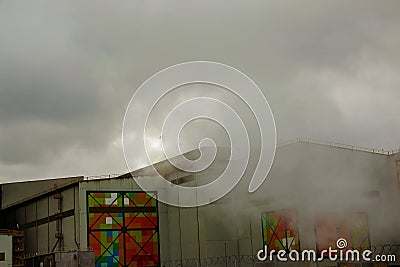 Environmental disaster. Harmful emissions into environment. Smoke and smog. Pollution of atmosphere by factory Editorial Stock Photo