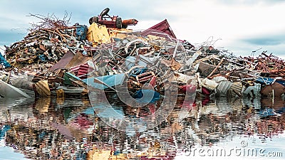 Environmental Pollution of the sea. A pile of junk, metal gabage and plastic in the ocean. Stock Photo