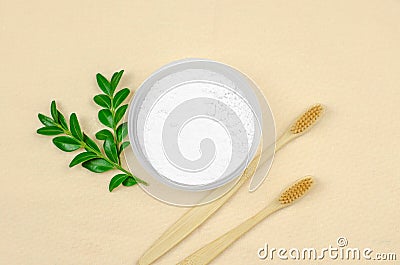 Environmentally friendly personal hygiene products. Oral cavity care. Bamboo toothbrushes and tooth powder on linen cloth Stock Photo