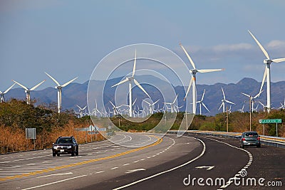 Road and Eolian electric generator in oaxaca, mexico II Editorial Stock Photo