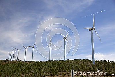 Eolic wind Turbines on a modern windmill farm Stock Photo