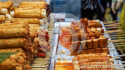 Eomuk, Korean street food. Fried fish cake stick with red sauce Stock Photo