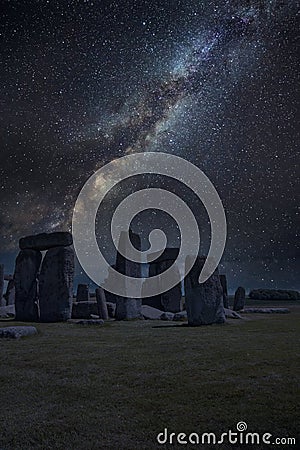 Epic digtial composite image of ibrant Milky Way over ancient monolithic standing stones in landscape Stock Photo