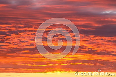 Epic dramatic sunset, sunrise orange sky with clouds and sunlight background Stock Photo