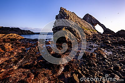 Epic View of Bowfinger Rock formation on the northern Moray Firth Coast of Scotland in the UK Stock Photo