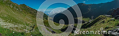 Epic winding road on Transfagarasan pass in Romania in summer time, with twisty road rising up. Road crossing Fagaras mountain Stock Photo