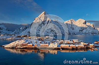 Epic winter seascape from Norway shot at sunrise with dynamic sky and pretty mountain Editorial Stock Photo