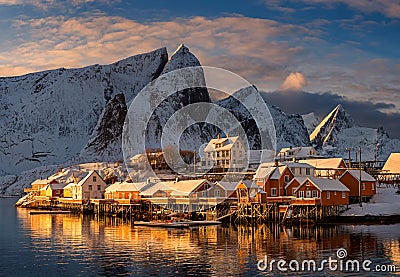 Epic winter seascape from Norway shot at sunrise with dynamic sky and pretty mountain Editorial Stock Photo