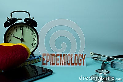 Epidemiology Planning on Background of Working Table with Office Supplies. Stock Photo