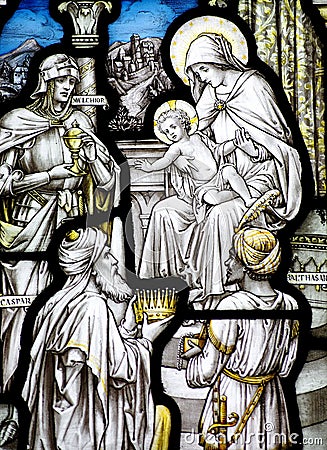 The Epiphany in stained glass (three kings visiting baby Jesus) Stock Photo