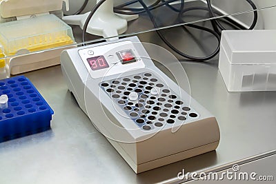 Eppendorf vials with the DNA samples in thermostat in the genetic laboratory, conducting polymerase chain reaction analysis Stock Photo