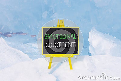 EQ emotional quotient symbol. Concept words EQ emotional quotient on beautiful yellow black blackboard. Beautiful blue ice Stock Photo
