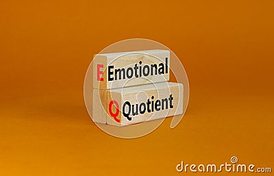 EQ emotional quotient symbol. Concept words EQ emotional quotient on wooden blocks on a beautiful orange table orange background. Stock Photo