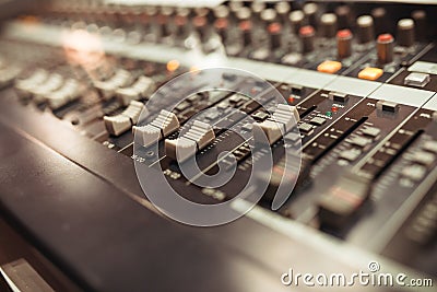 Equalizer adjusting Sound recording studio mixing desk. Stock Photo