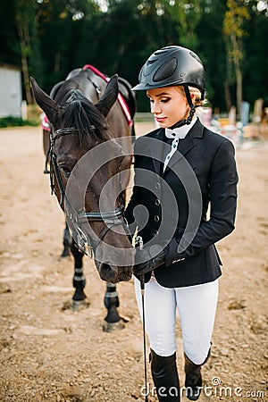 Equestrian sport, female jockey and horse Stock Photo