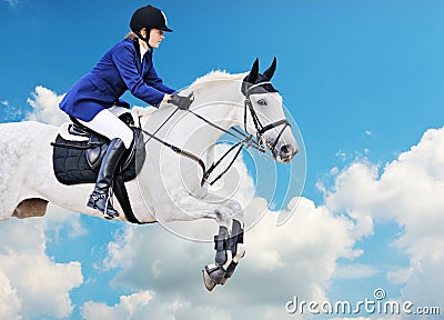 Equestrian sport: young girl in jumping show Stock Photo