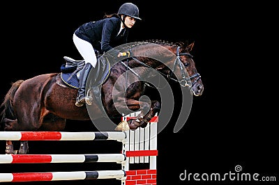 Equestrianism: Young girl in jumping show, isolated on black Stock Photo