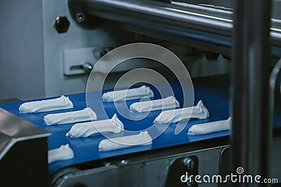 Equipment blanks of dough, a machine for stacking cookies with the diaphragm, the production of biscuits Stock Photo