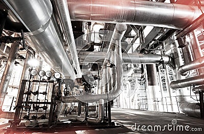 Equipment, cables and piping as found inside of a modern industrial power plant Stock Photo