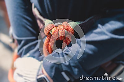 Equipment for climbing sport outdoor, rock climbing alpinism mountaineering gear with helmet, belt, carabiner, rope, harness with Stock Photo