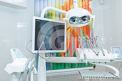 Equipment and dental instruments in dentist`s office,monitor. Dentistry.Design of new modern dental clinic office with Stock Photo