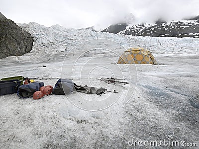 Equipment For Ice Climbing And A Tent On Mendenhall Glacier In Alaska Stock Photo