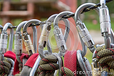 Equipment for mountaineering and climbing, ropes, carabiners, ropes. Sports recreation in the woods on the climbing wall. Close up Stock Photo
