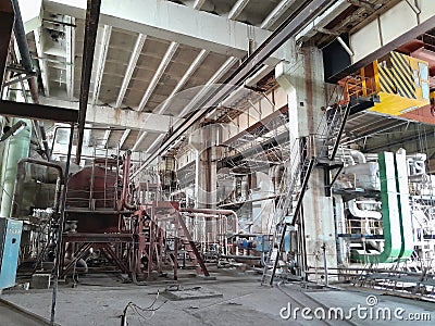 Equipment, piping and electrical machines inside of modern industrial power plant Stock Photo