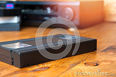 Equipment for playing VHS tapes on a wooden table Stock Photo