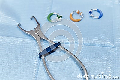 equipment pliers for dental treatment close up on blue Stock Photo