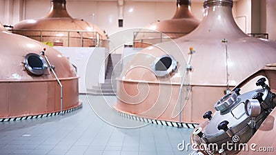 Equipment for preparation of beer. Lines of cooper tanks in brewery. Manufacturable process of brewage. Mode of beer Stock Photo
