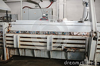 Equipment for pressing paper waste at a waste sorting plant. Stock Photo