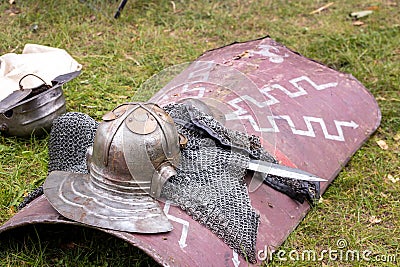 Equipment of a Roman legionnaire on the ground, Shield, helmet, sword and chain mail Stock Photo