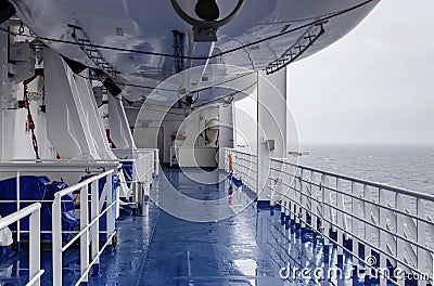 Equipment for saving lives on the deck of a ship on a cloudy, rainy day Stock Photo