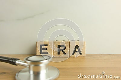 ERA estrogen receptor assay acronym from wooden blocks with stethoscope Stock Photo