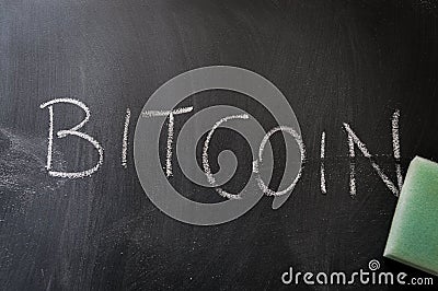 Erasing bitcoin, hand written word on blackboard being erased concept Stock Photo